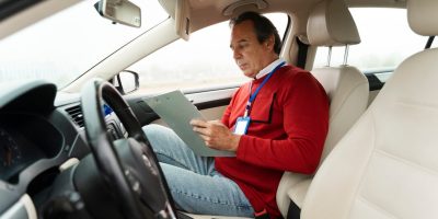 person-taking-driver-s-license-exam_23-2149891376